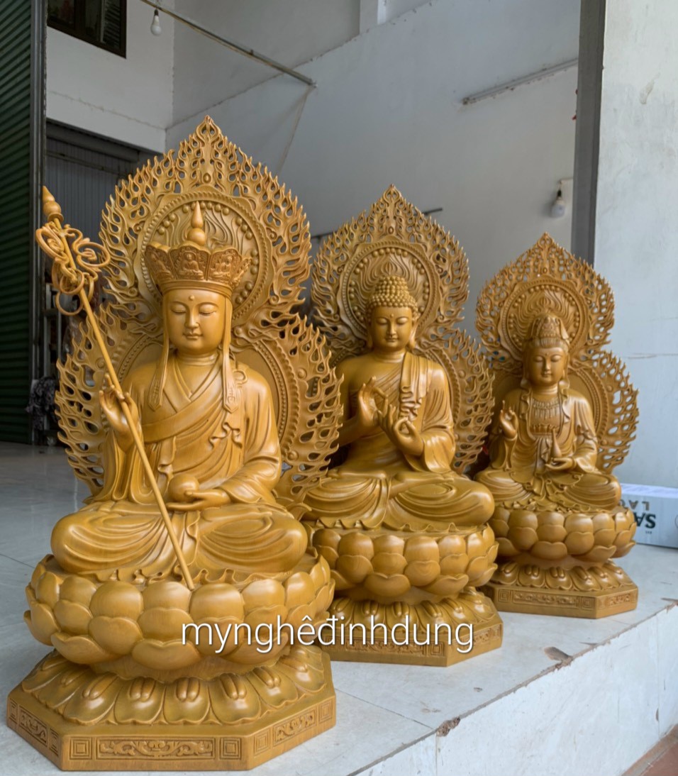 Bộ tượng phật tam thánh bằng gỗ hương đá sơn vàng kt cao 50×35×30cm+lá chắn hào quang là 65cm
