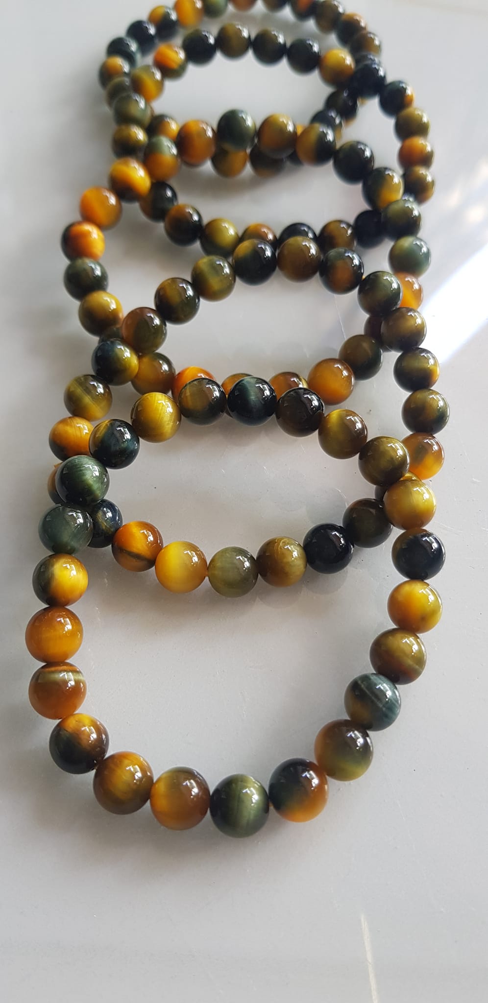 Vòng tay phong thủy may mắn Nữ đá mắt hổ tự nhiên vàng xanh đều mới bóng mượt đẹp Size hạt 8mm Nữ đeo Công dụng vòng đá mắt hổ đá thiên nhiên tốt cho sức khỏe, đem đến may mắn,xoa dịu tâm trí công việc hanh thông ạ