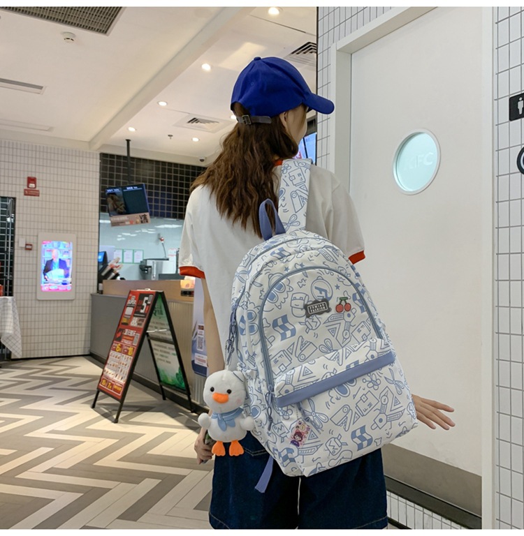 Balo vải học sinh, sinh viên thời trang in hình Doodle Dụng cụ học tập lạ mắt