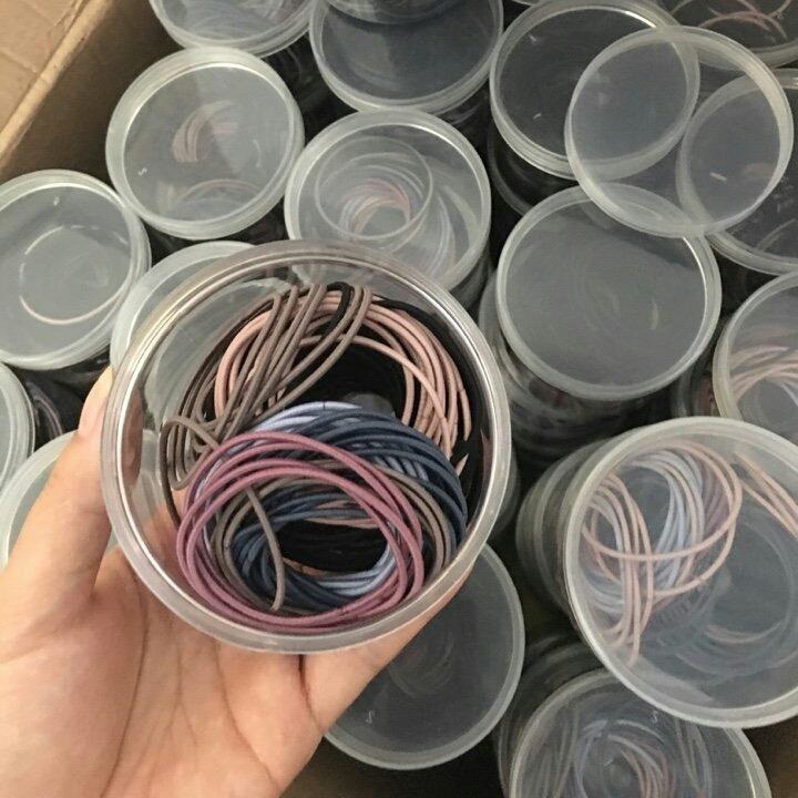 Set 100 chiếc chun cột tóc trơn nhiều màu sắc có hộp đựng bằng nhựa