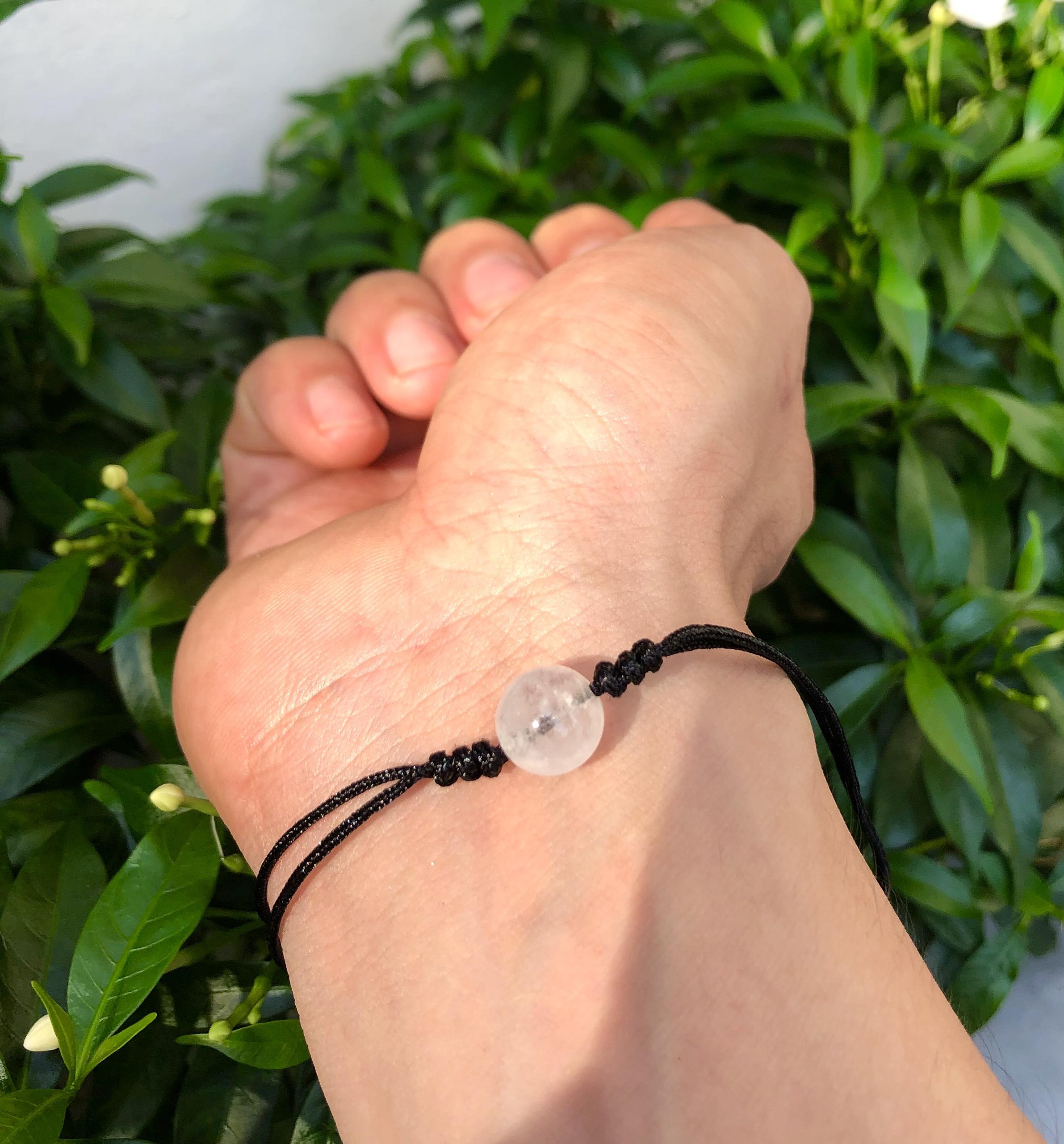 Vòng tay đá thạch anh trắng đan dây đen tự nhiên