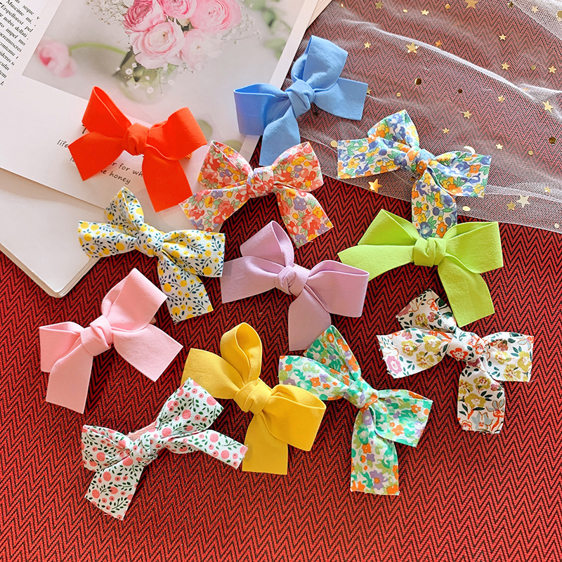 Kẹp tóc cho bé gái set 2 chiếc đính nơ rất dễ thương PK36 - Cam