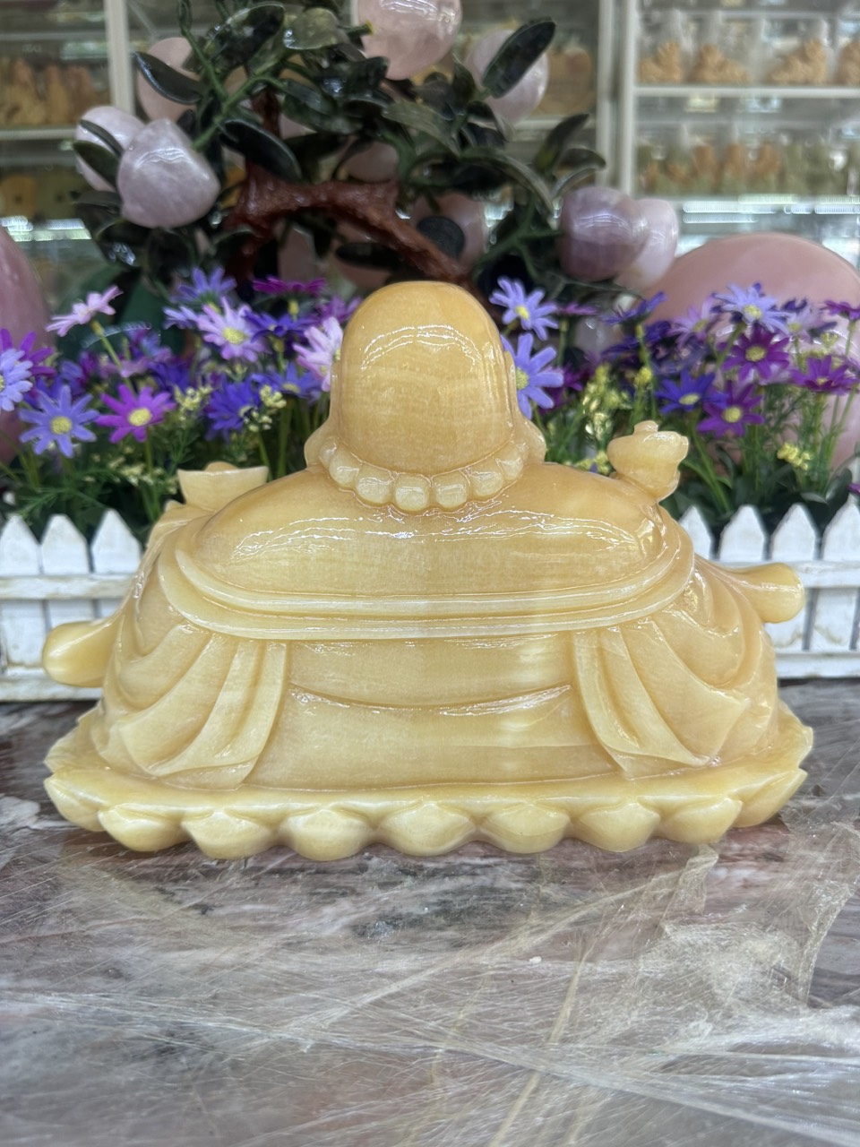 Tượng Phật Di Lặc ngồi tựa bao tiền cầm thỏi vàng phong thủy đá ngọc hoàng long - Dài 30 cm