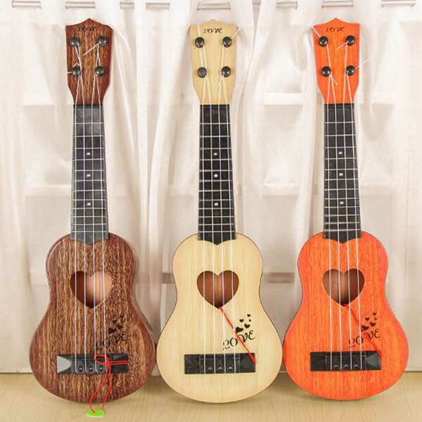Đàn Ukulele Nhựa Cho Bé Đàn Ghi Ta Mini Nhiều Mẫu Dễ Thương Cho Bé Màu Vân Gỗ Giao Hoạ Tiết Ngẫu Nhiên