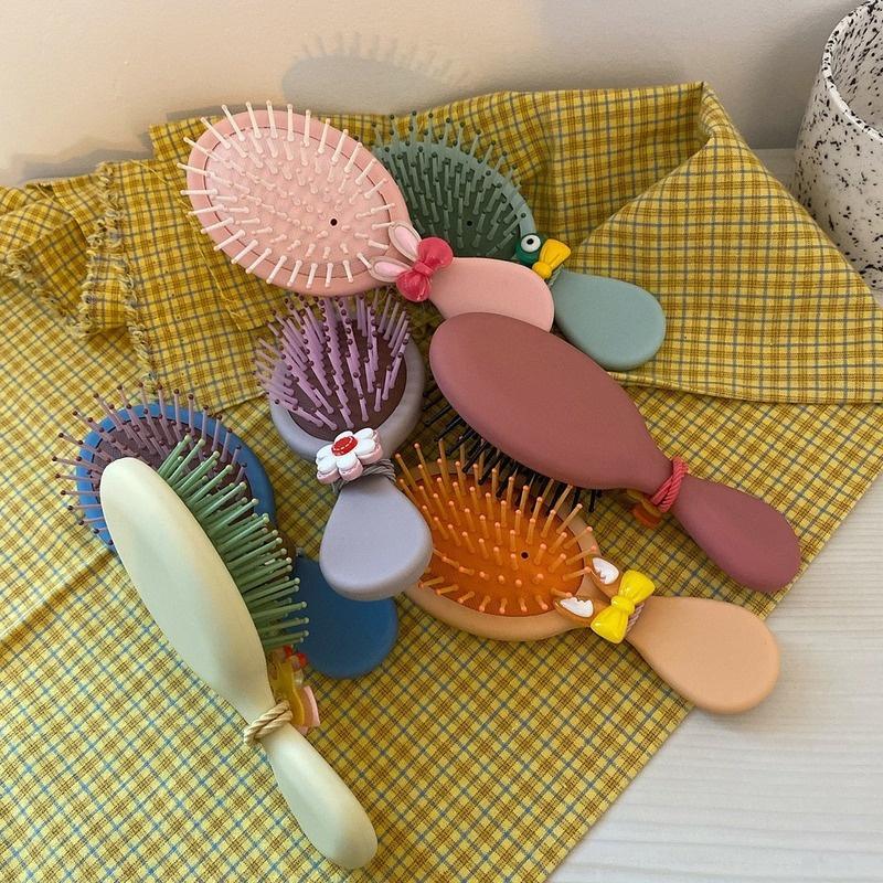 Lược chải tóc mini mát xa da đầu thiết kế kiểu hoạt hình dễ thương cho nữ