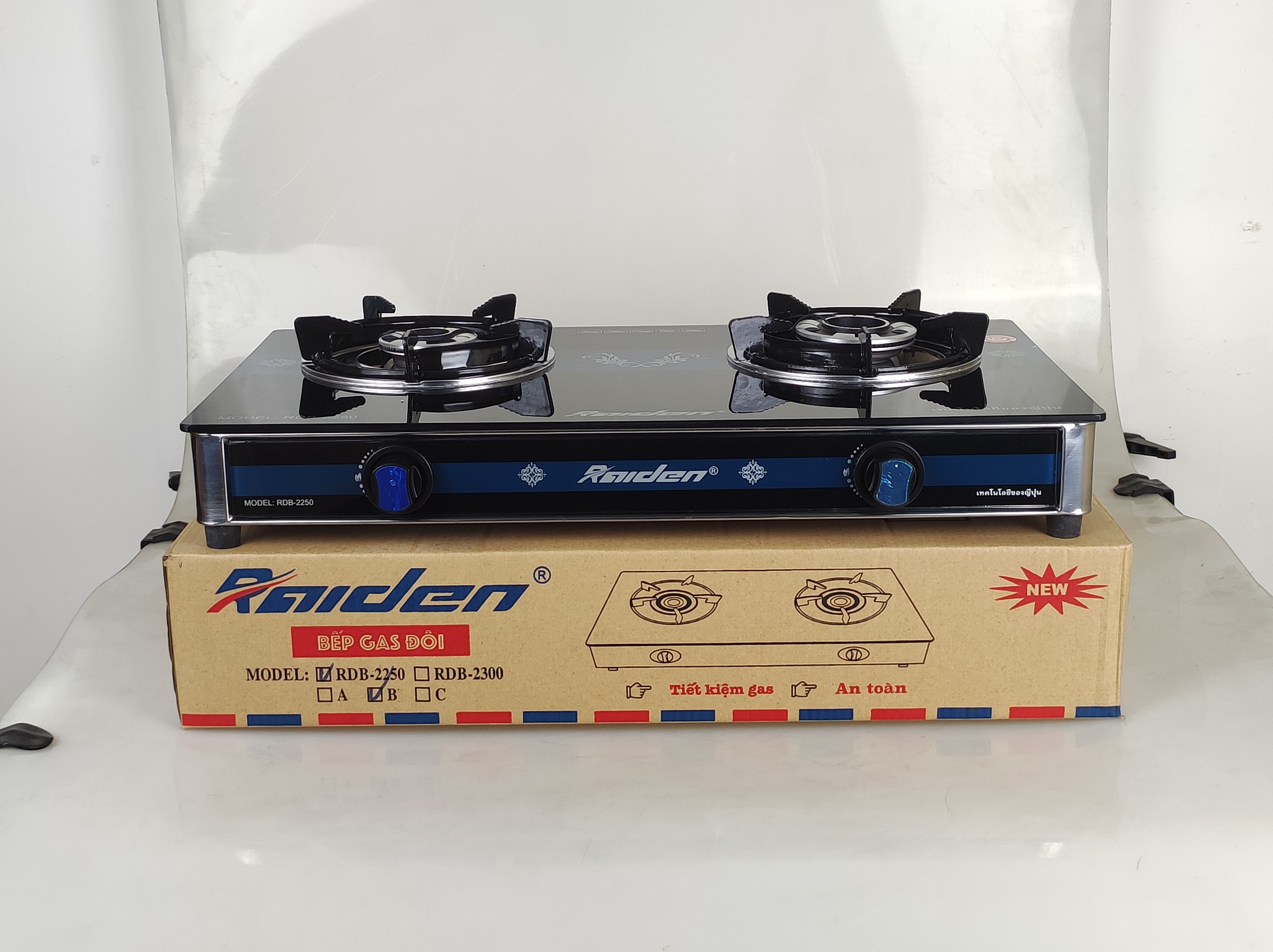 Bếp ga đôi kiếng cường lực Raiden RDB2250B, kiềng men 5mm, kính 7ly, mũ nhôm-Hàng chính hãng