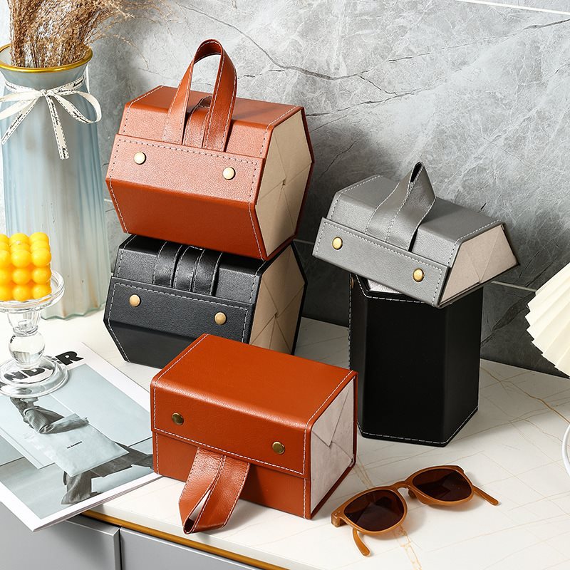 Hộp đựng kính 3 ngăn cuộn tròn , da PU , có thể xách tay và treo ,mang đi mọi nơi rất tiện lợi , bảo vệ kính khỏi trầy xước và hư hỏng