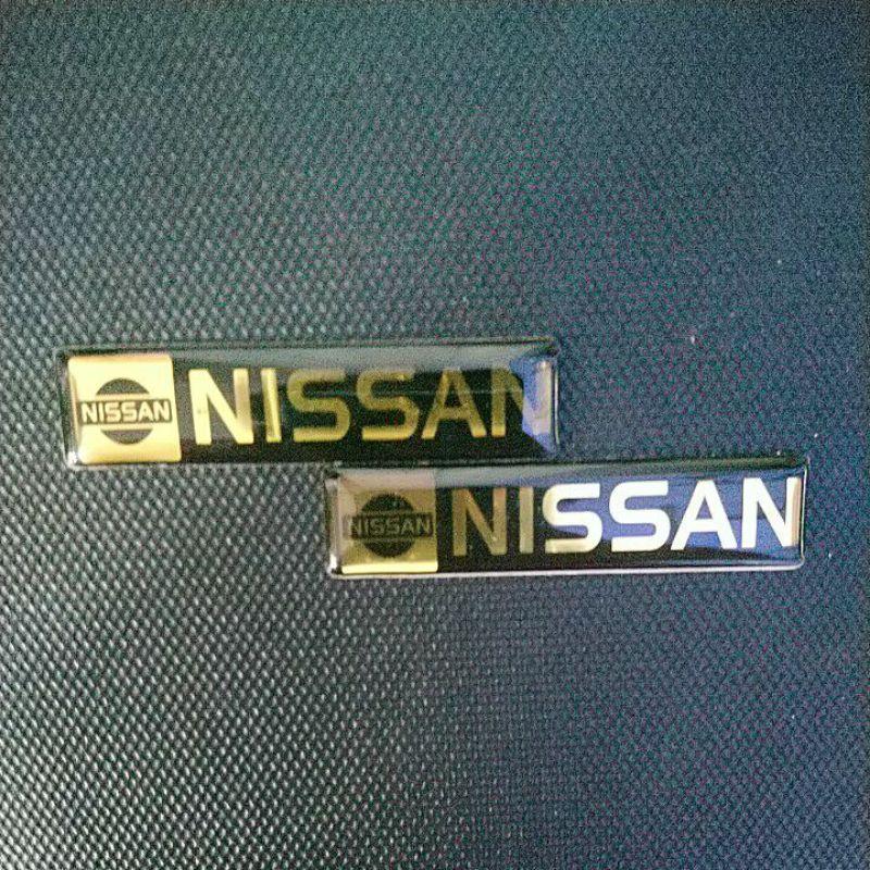 Tem biểu tượng Nissan