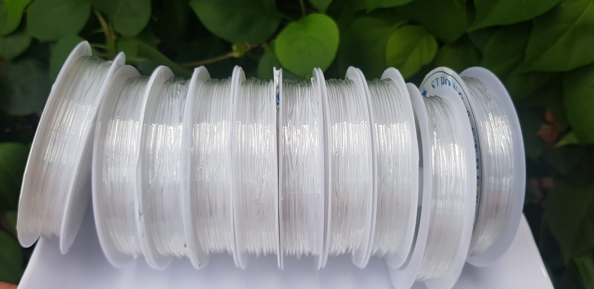 Khoanh tròn cuộn Thun Dẻo Màu trắng nhỏ chuyên xỏ tất cả vòng đeo tay Thun dẻo trắng xỏ vòng tay nam nữ ạ