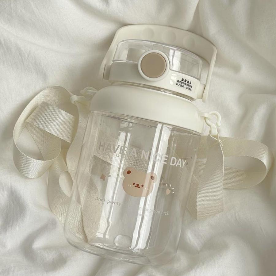 Bình nước cute hình gấu 1000ml dễ thương có quai xách và ống hút cô gái, bình đựng nước cho bé Gấu nâu be Ongvove BN