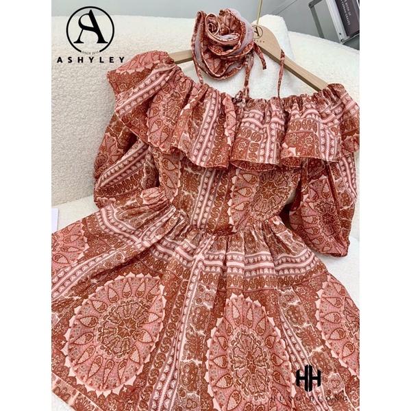 Váy trễ vai kèm hoa cam đất