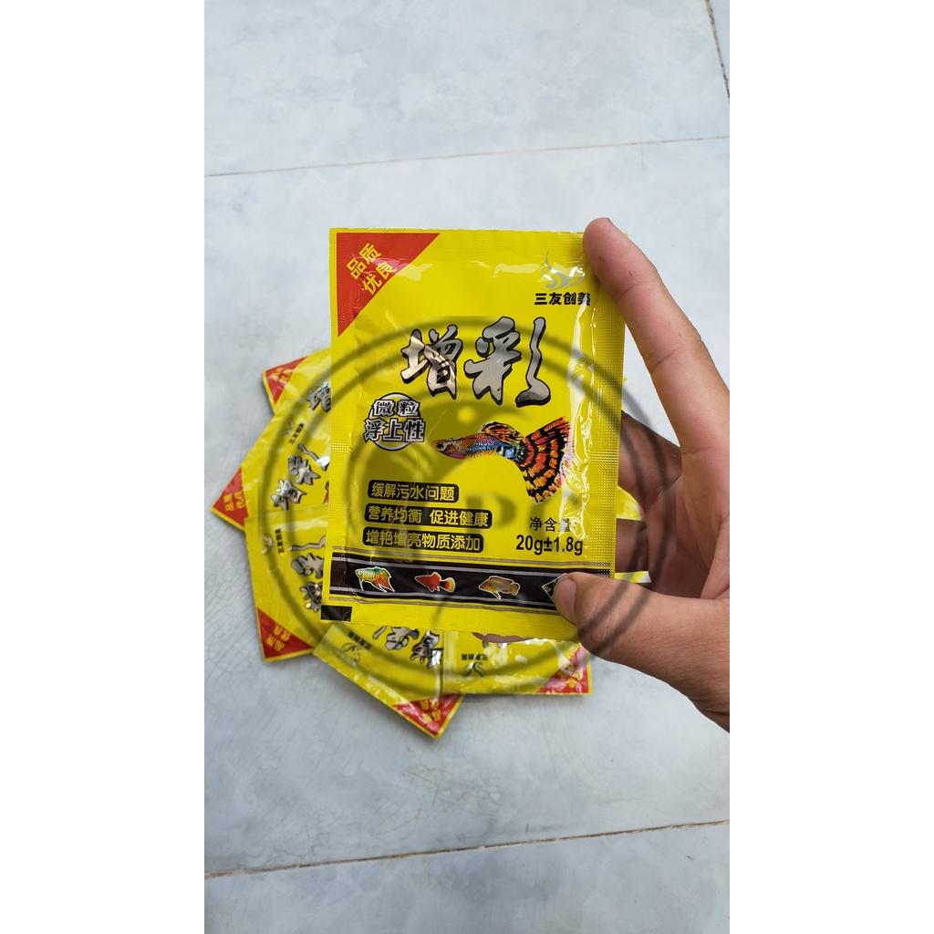 Thức ăn cho cá 7 màu Guppy Túi vàng 20gr giàu dinh dưỡng giúp cá mau lớn
