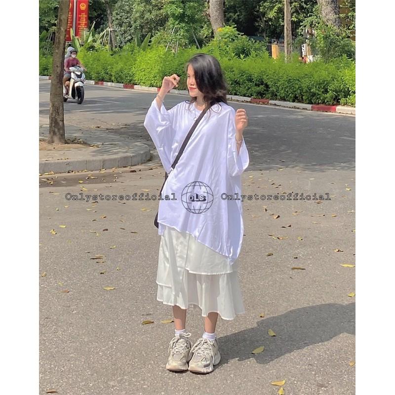 Áo xẻ tà oversize và chân váy tà lệch