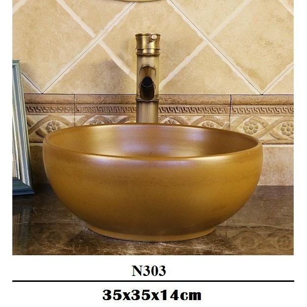 Chậu sứ lavabo để bàn hoa văn nghệ thuật với tông vàng chủ đạo