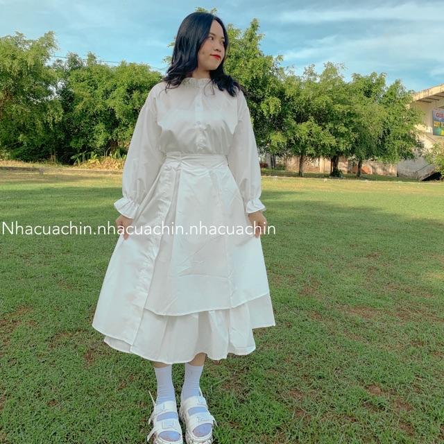 Chân váy trắng vạt thấp vạt cao