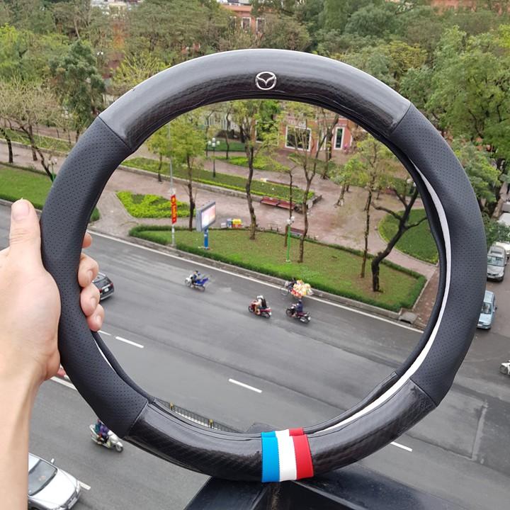 Bọc vô lăng vân Carbon cao cấp Logo theo hãng xe Mazda