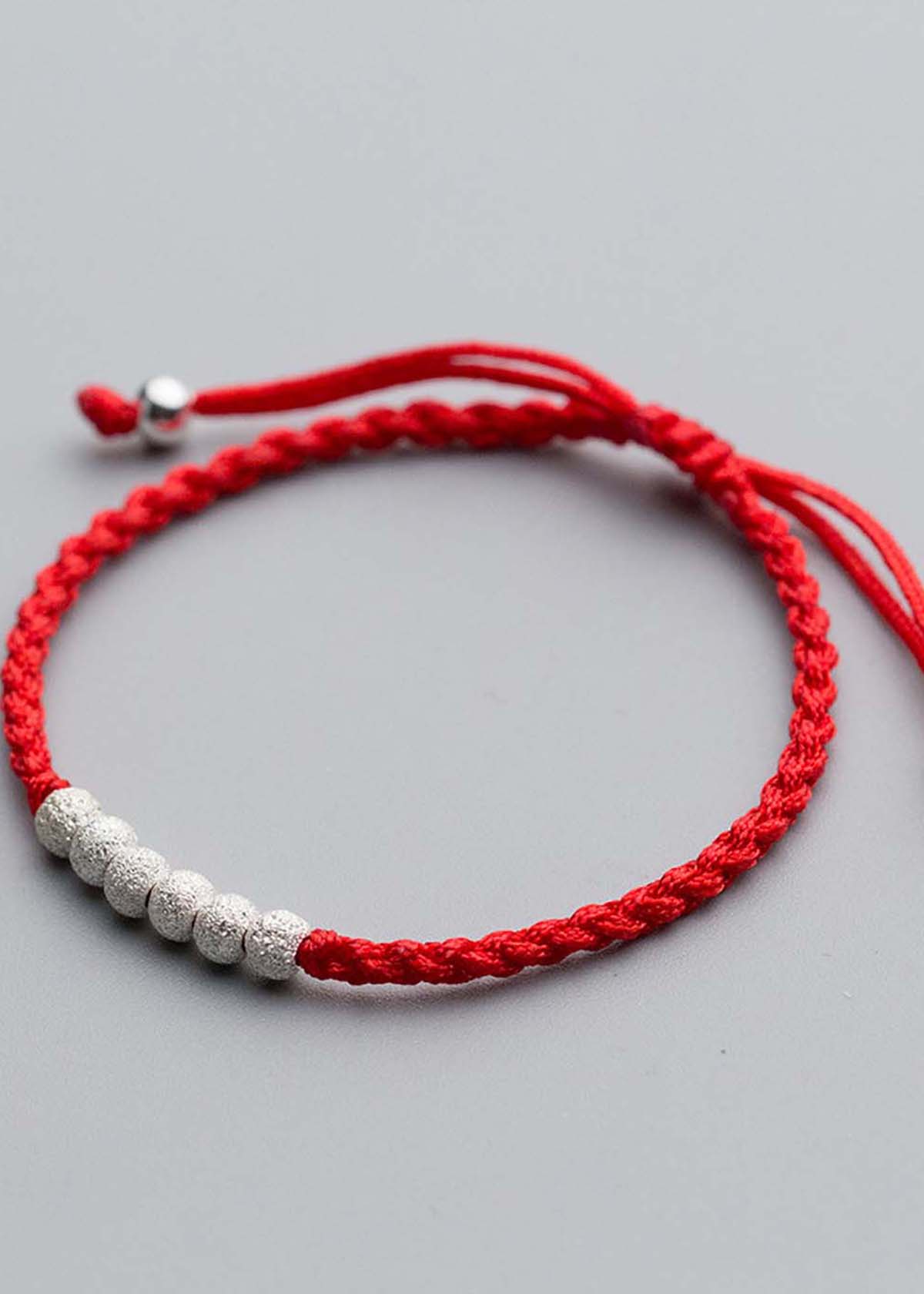Combo 2 vòng thắt dây đỏ charm bạc - Ngọc Quý Gemstones