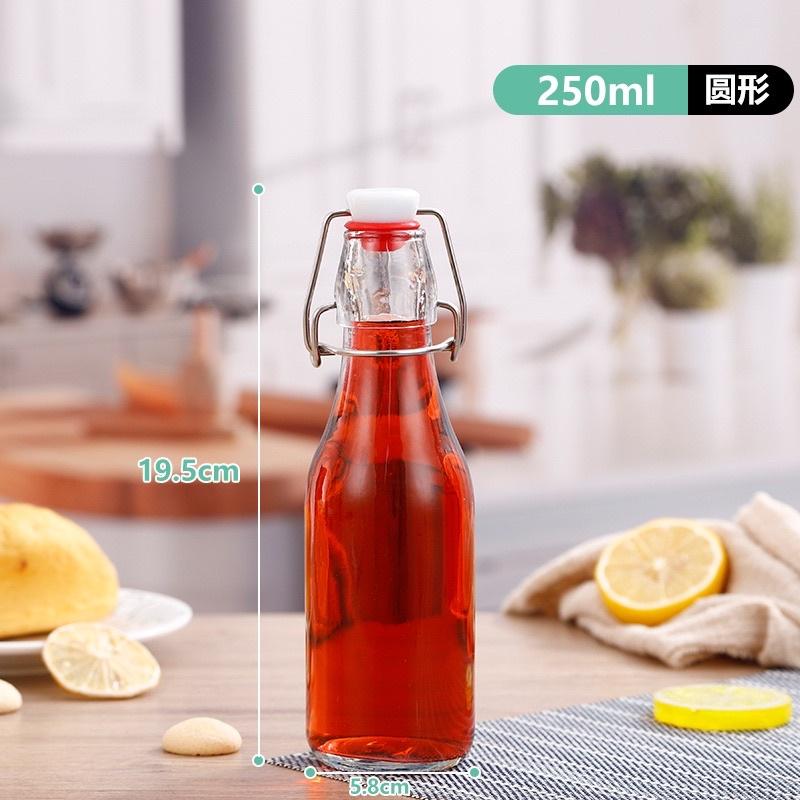 Chai thủy tinh nắp quai cài trong suốt