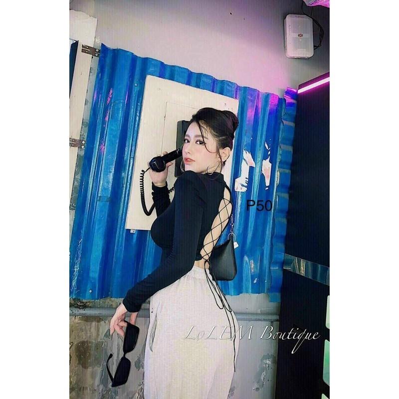 Áo croptop tay dài cổ cao đan dây lưng