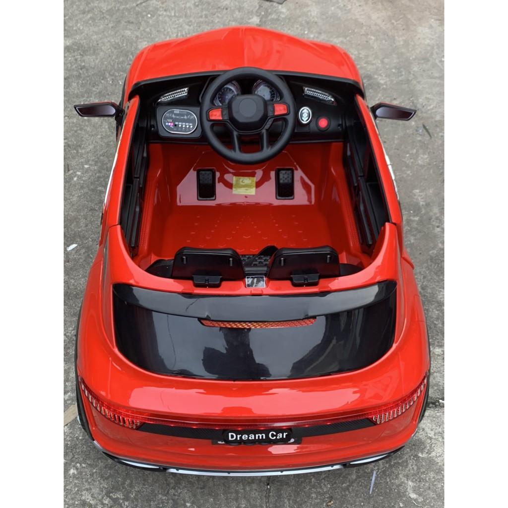 Ô tô xe điện đồ chơi DUCAIT JM2189 vận động cho bé 2 chỗ tự lái và điều khiển từ xa (Đỏ-Trắng-Xanh)