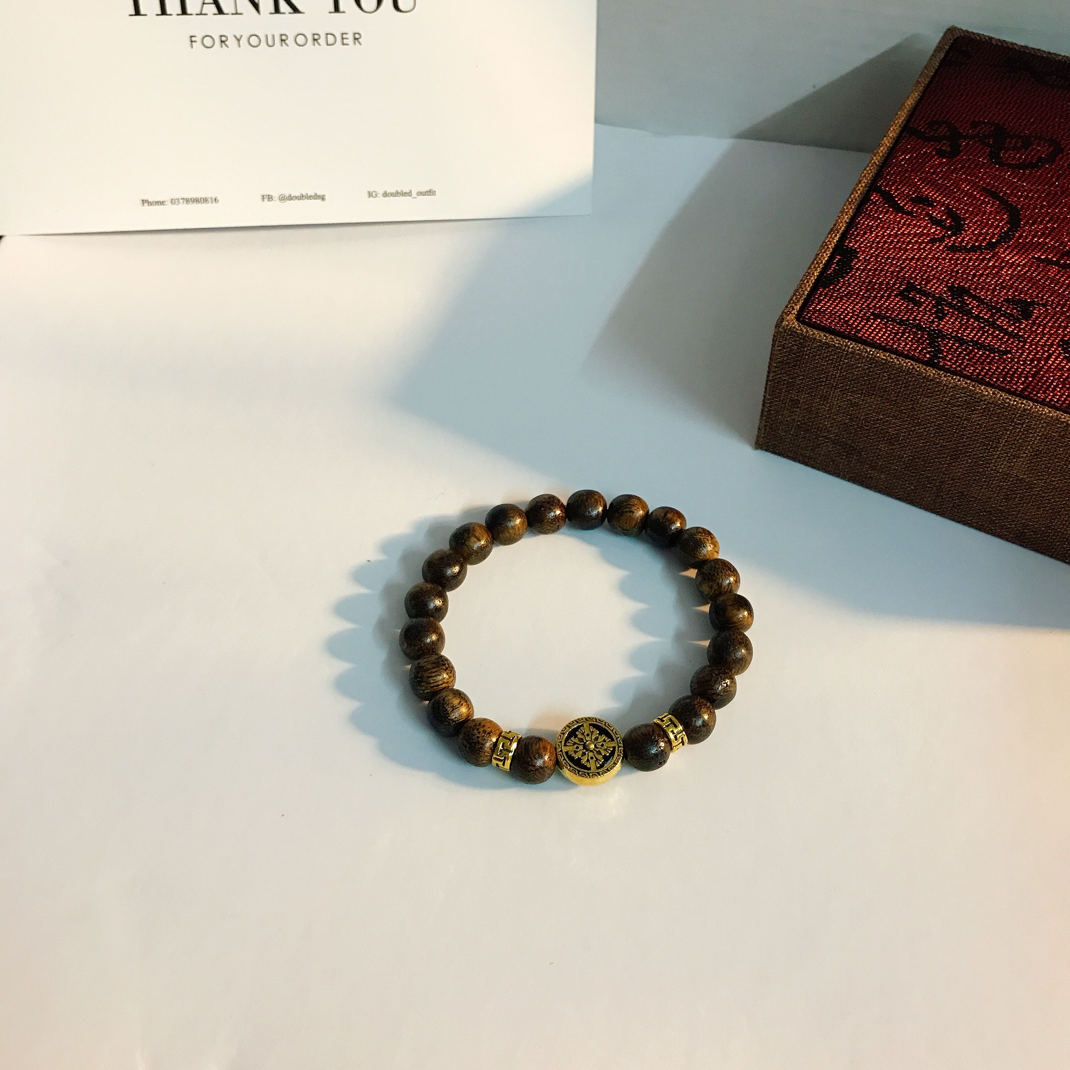 Vòng tay trầm hương pháp luân mạ vàng 18k