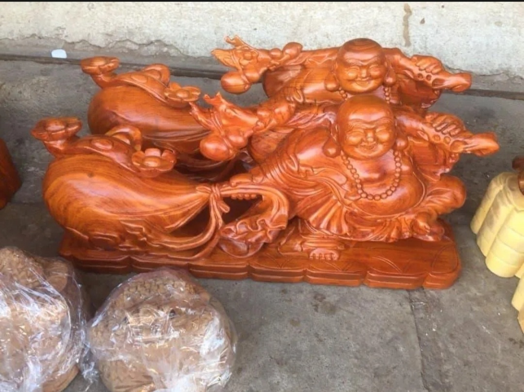 Tượng phật kéo bao tiền gỗ hương nguyên khối ngang 38 cm