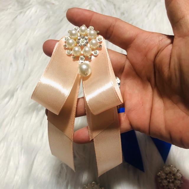 Cài áo nơ. KT 7 x 14cm. Có nhiều màu