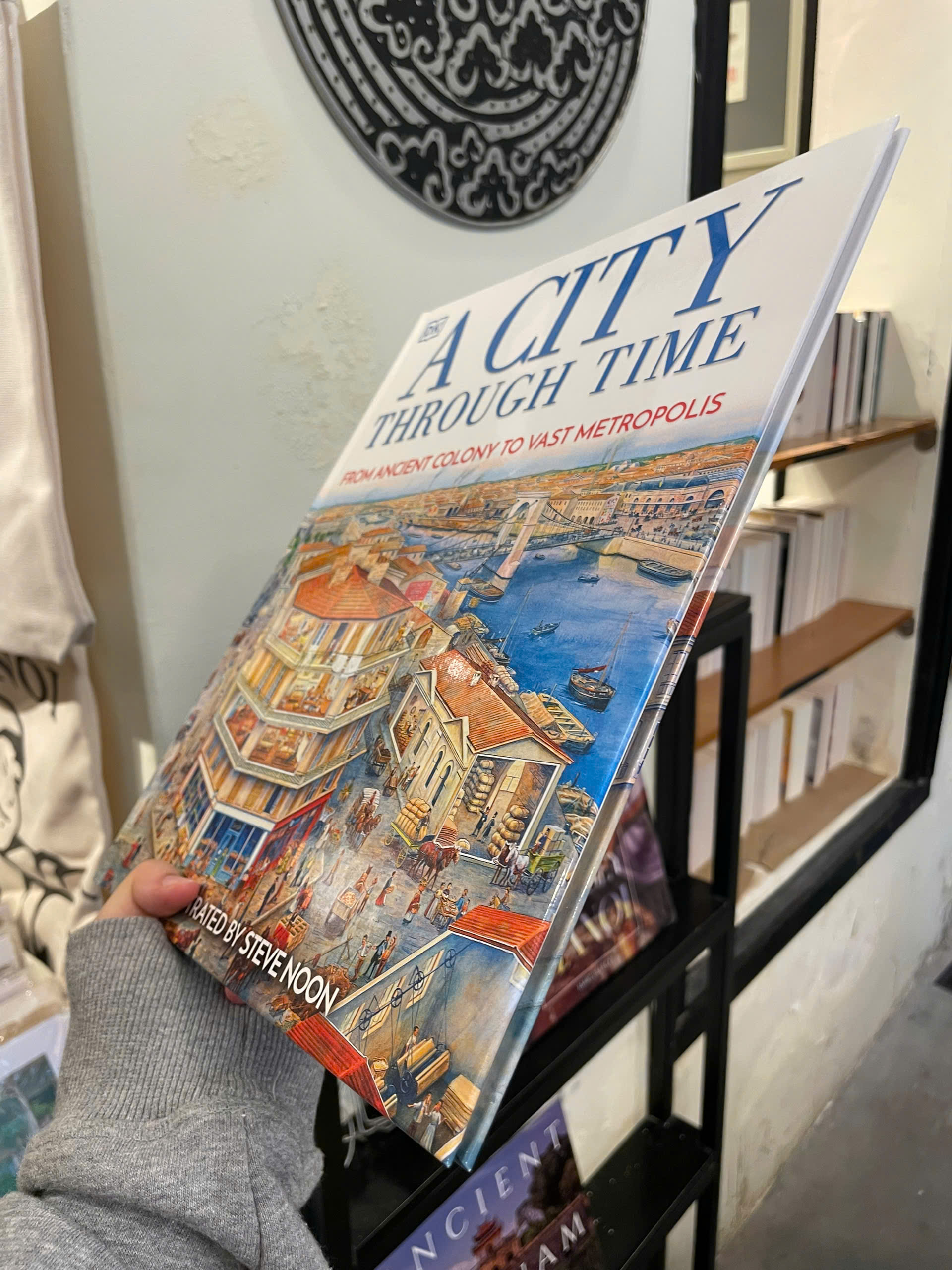 Sách - A City Through Time: From Ancient Colony To Vast Metropolis by Steve Noon - Bìa Cứng