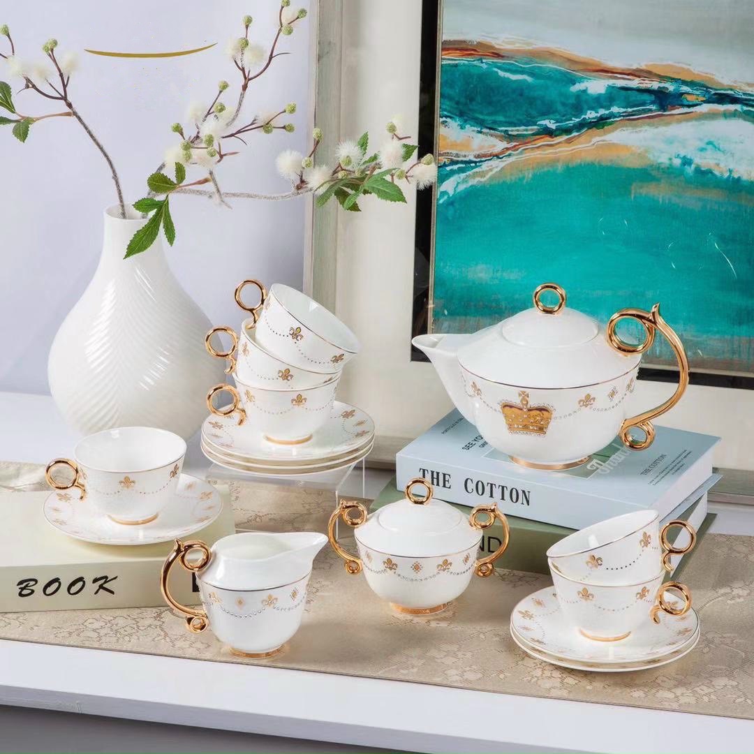 BỘ ẤM CHÉN PHA TRÀ SỨ XƯƠNG VƯƠNG MIỆN TRẮNG QUAI VÀNG CAO CẤP - GTN