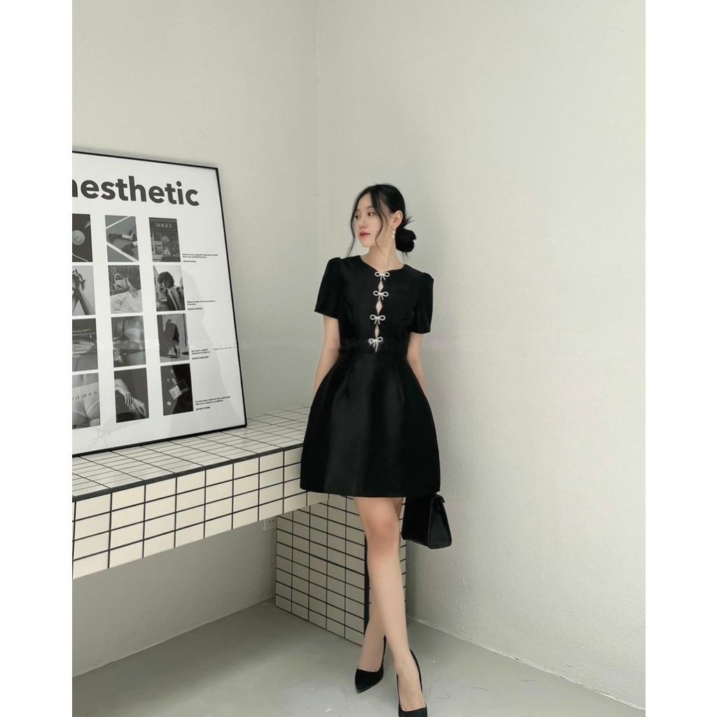 Đầm váy thiết kế khoét ngực tafta lót lụađính nơ đen tay ngắn phồng chữ A đi biển dự tiệc dạo phố bigsize cao cấp