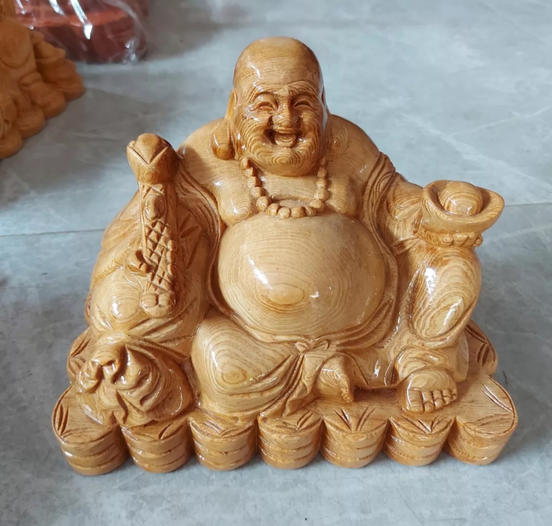 Tượng phật di lặc ngồi gỗ pomu ngang 25cm