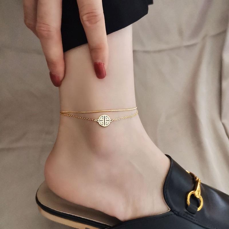 Lắc chân vòng chân nữ titan không đen mặt tròn phúc Ring house