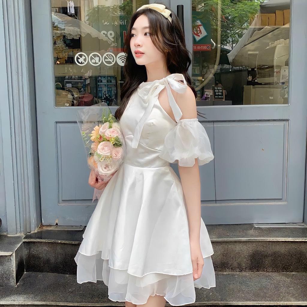 Đầm xòe tầng khoét vai cột nơ tay phồng