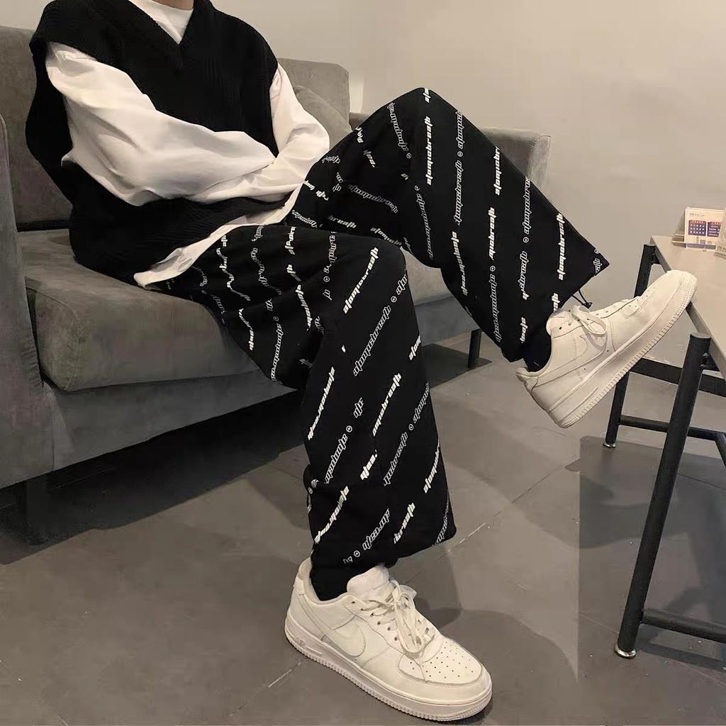 Quần jogger nữ chốt gấu hoạ tiết chữ chéo freesize ống rộng