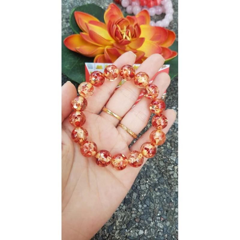 Vòng tay chuỗi hạt nhựa vàng cam