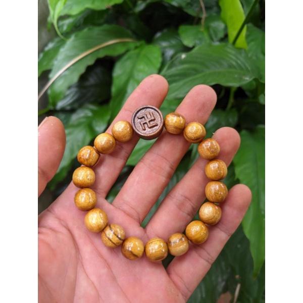 Vòng lắc tay nữ người lớn gỗ dâu tằm loại hạt 10 ly charm chữ vạn