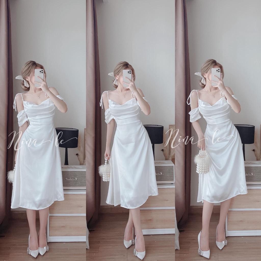 Đầm váy dự tiệc hai dây trễ vai xếp ly ngực màu trắng tinh khôi giúp nàng nổi bật.