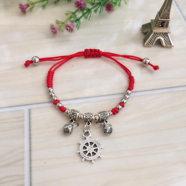 Vòng tay HandMade dây đỏ phối mặt bánh lái