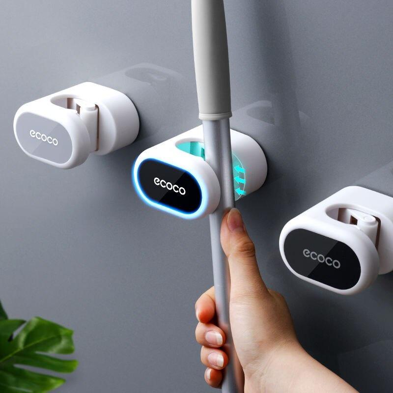 Giá đỡ dán tường treo cây lau nhà, chổi trong phòng tắm.