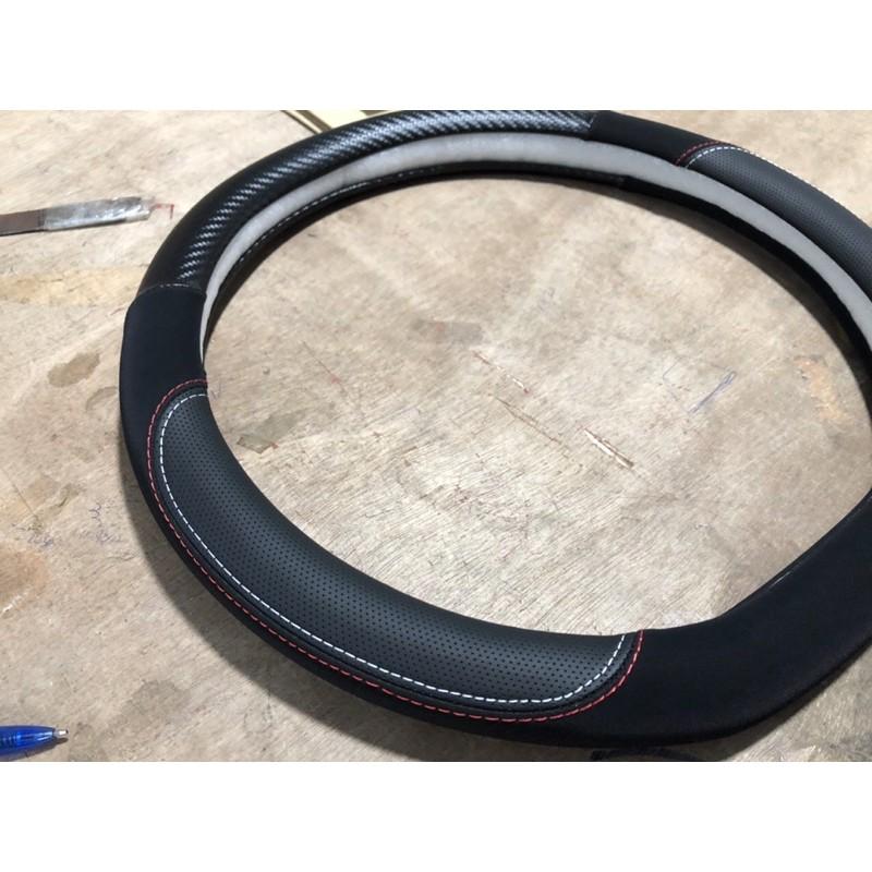 Bọc vô lăng da + carbon cao cấp dành cho xe hơi