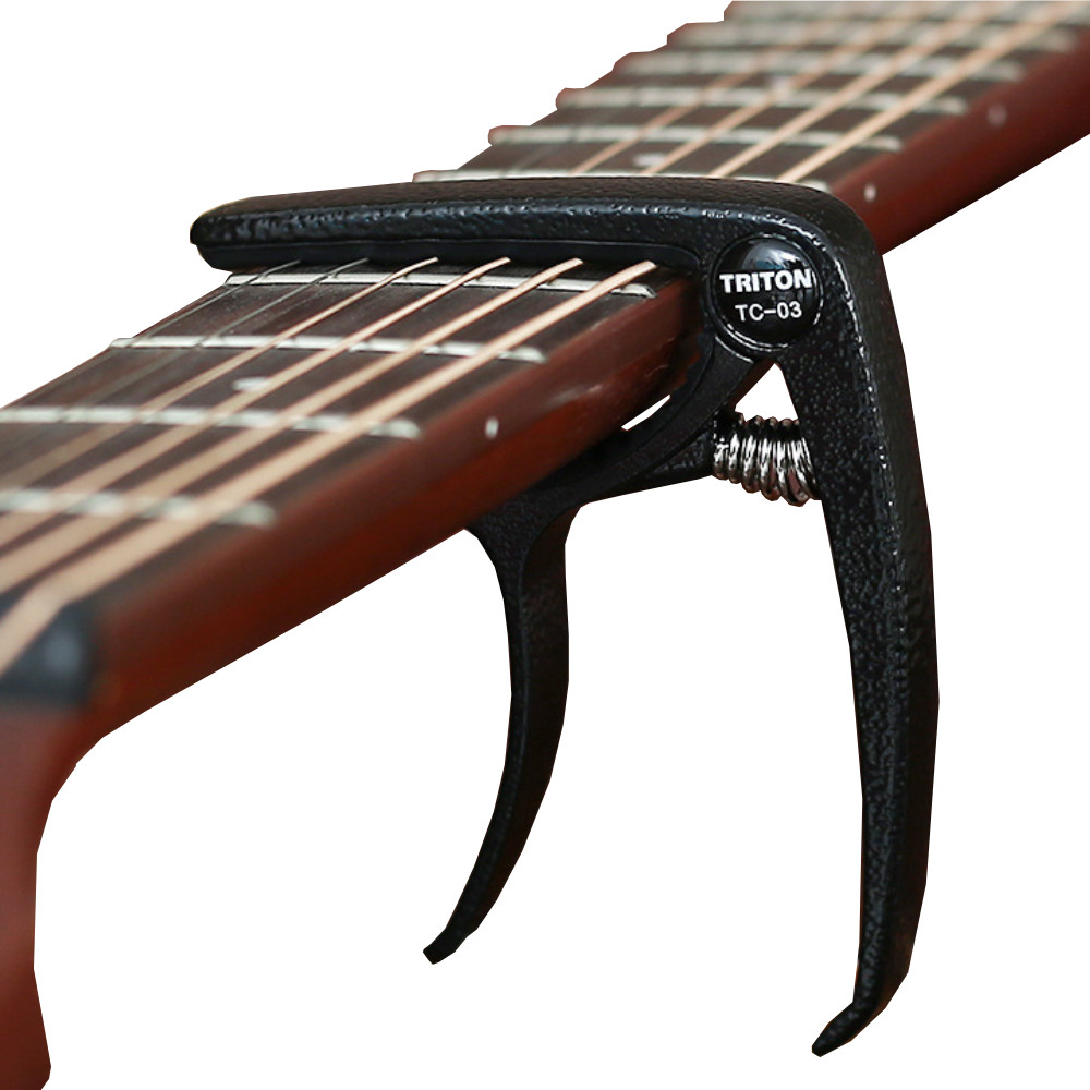 Capo Đàn Guitar/Ukulele Vân Gỗ Woim TC-03 ( Màu ngẫu nhiên )