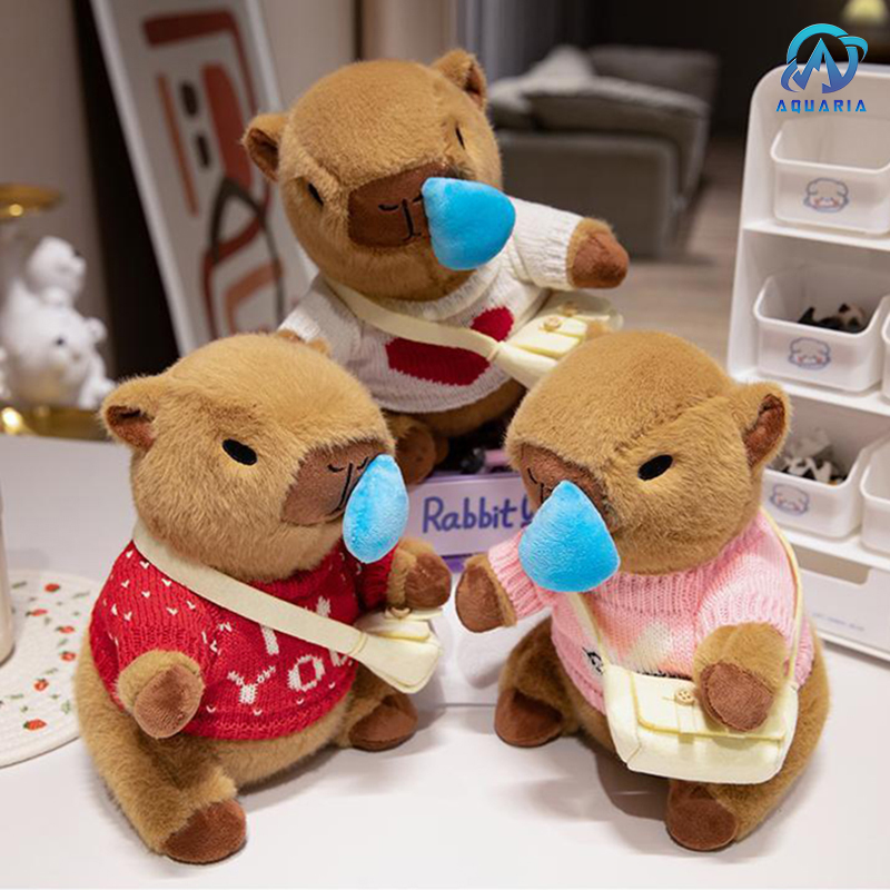 Gấu Bông Thú Nhồi Bông Capybara Mặc Áo Len Đeo Túi Có Thể Kéo Mũi Siêu Đáng Yêu 25cm (Mẫu Áo Len Ngẫu Nhiên)
