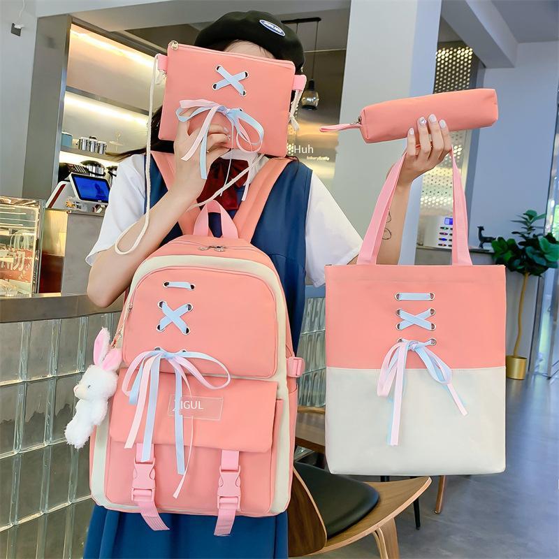 Cặp học sinh nữ phong cách mới nhất phiên bản Hàn Quốc của phong cách Harajuku sức chứa lớn ba lô màu sắc nổi bật học sinh trung học cơ sở học sinh tiểu học ba lô bốn mảnh túi hướng dẫn