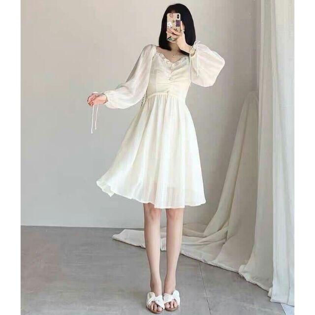 Đầm trắng nhún ngực cột nơ tay