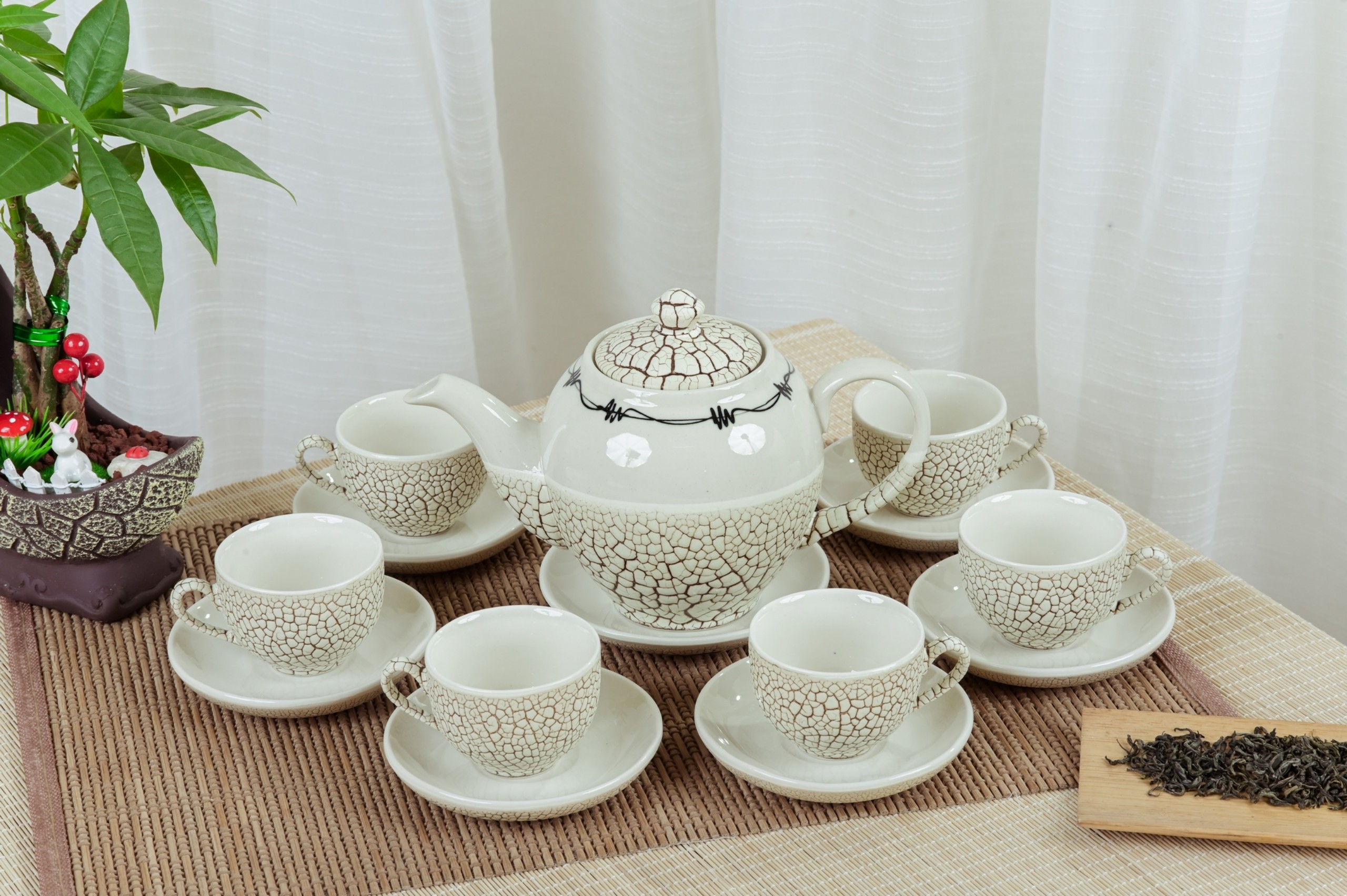 Bộ ấm chén chóp lửa men lưới trắng