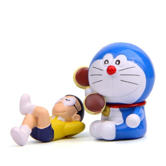 Mô hình Nobita lười biếng nằm ngủ và mèo Doraemon ăn bánh rán quen thuộc