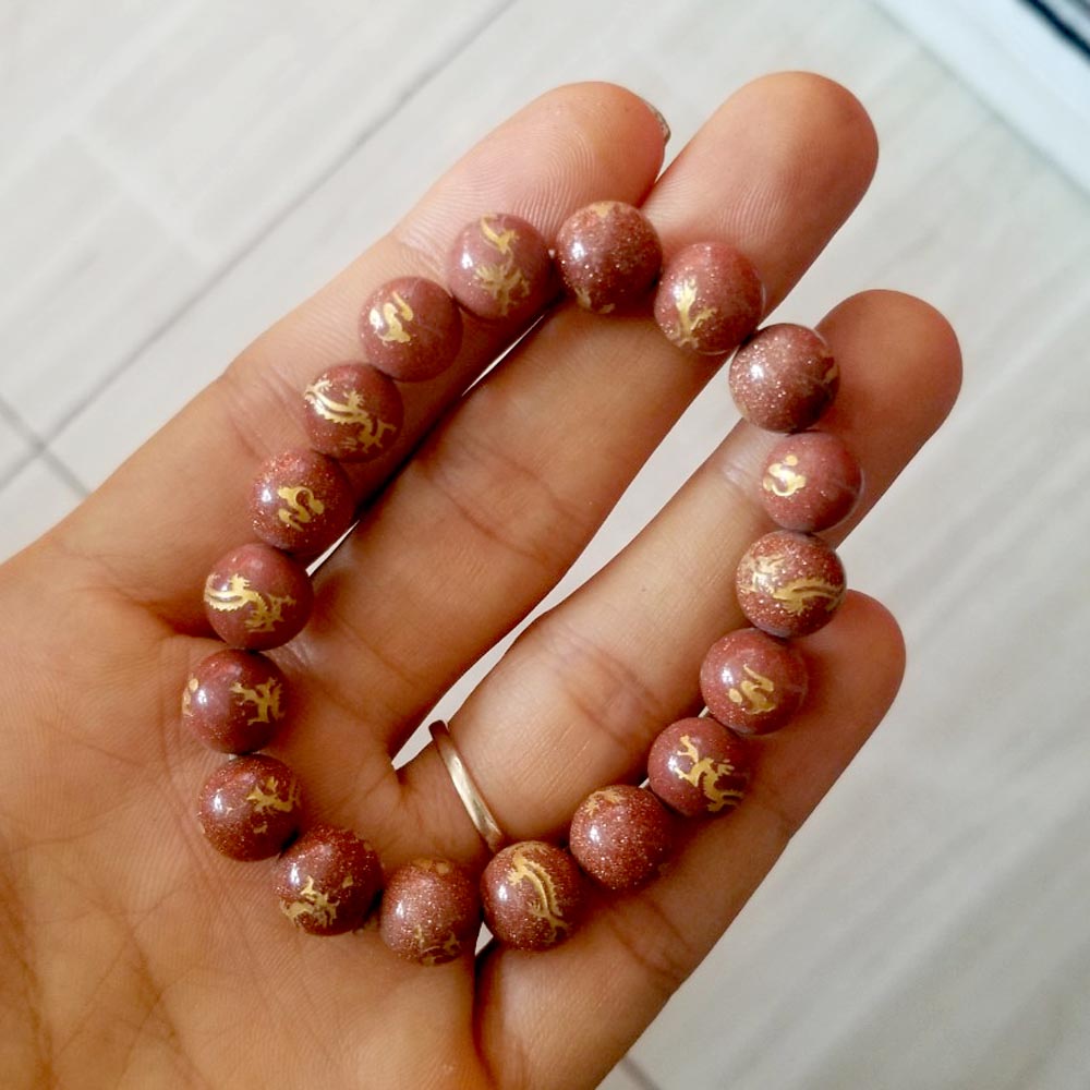 Vòng tay chuỗi đá kim sa khắc hình rồng vàng