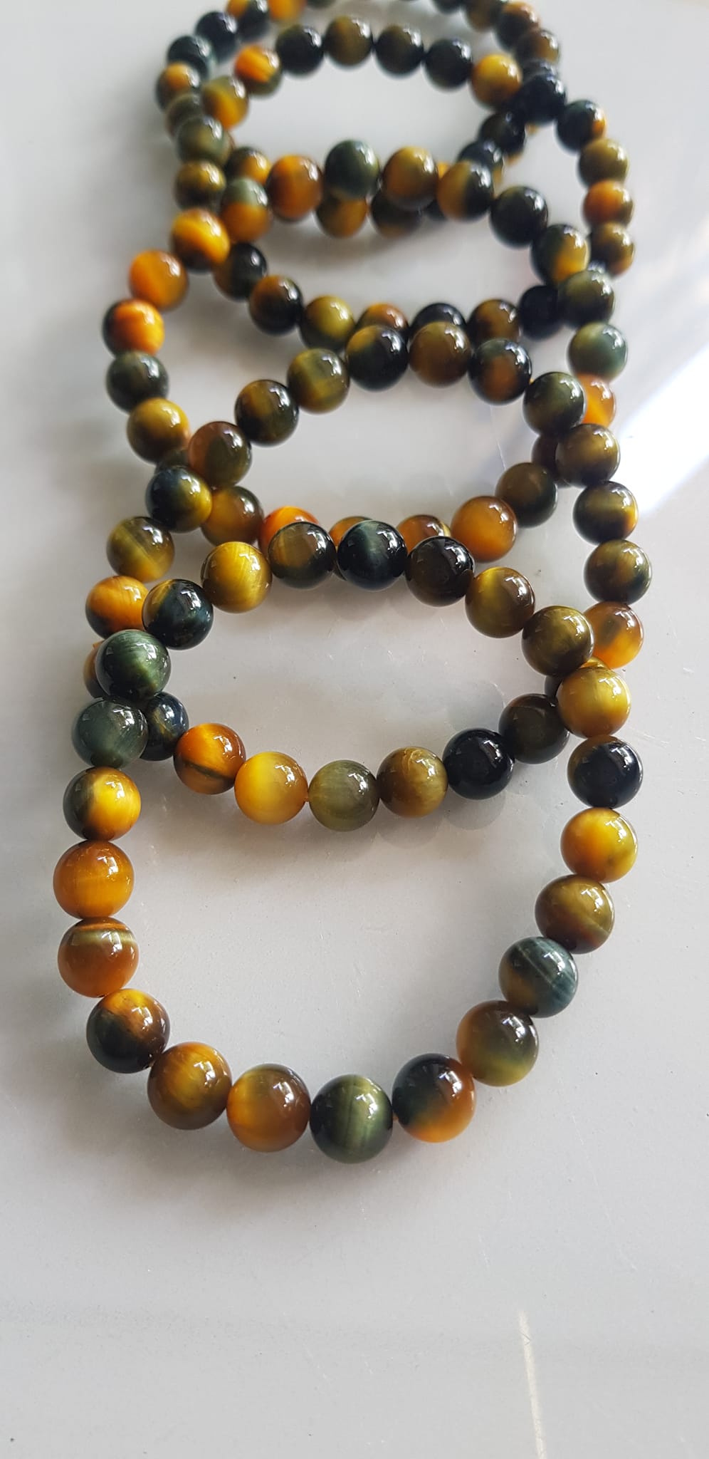 Vòng tay phong thủy may mắn Nữ đá mắt hổ tự nhiên vàng xanh đều mới bóng mượt đẹp Size hạt 8mm Nữ đeo Công dụng vòng đá mắt hổ đá thiên nhiên tốt cho sức khỏe, đem đến may mắn,xoa dịu tâm trí công việc hanh thông ạ