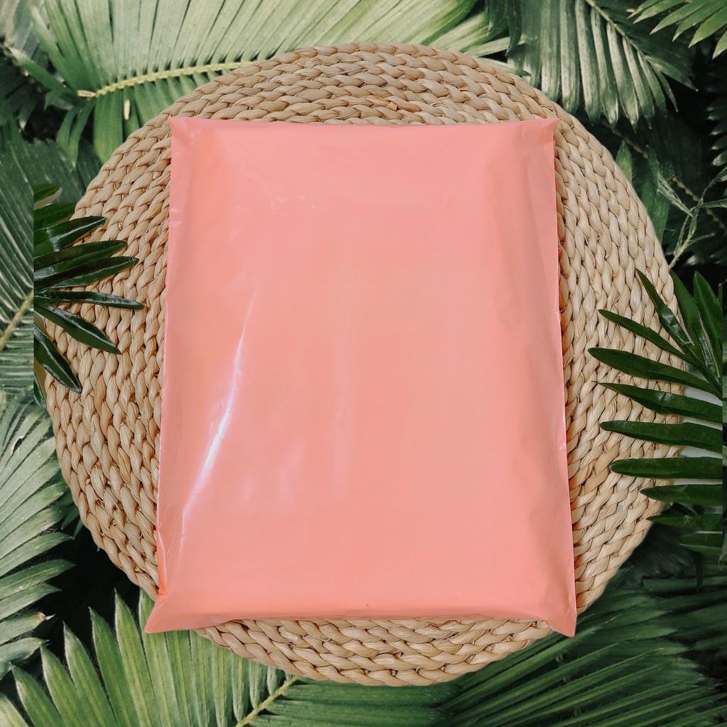 Túi gói hàng túi đóng hàng size 32x45cm cuộn 100 túi màu hồng đào loại bóng dẻo