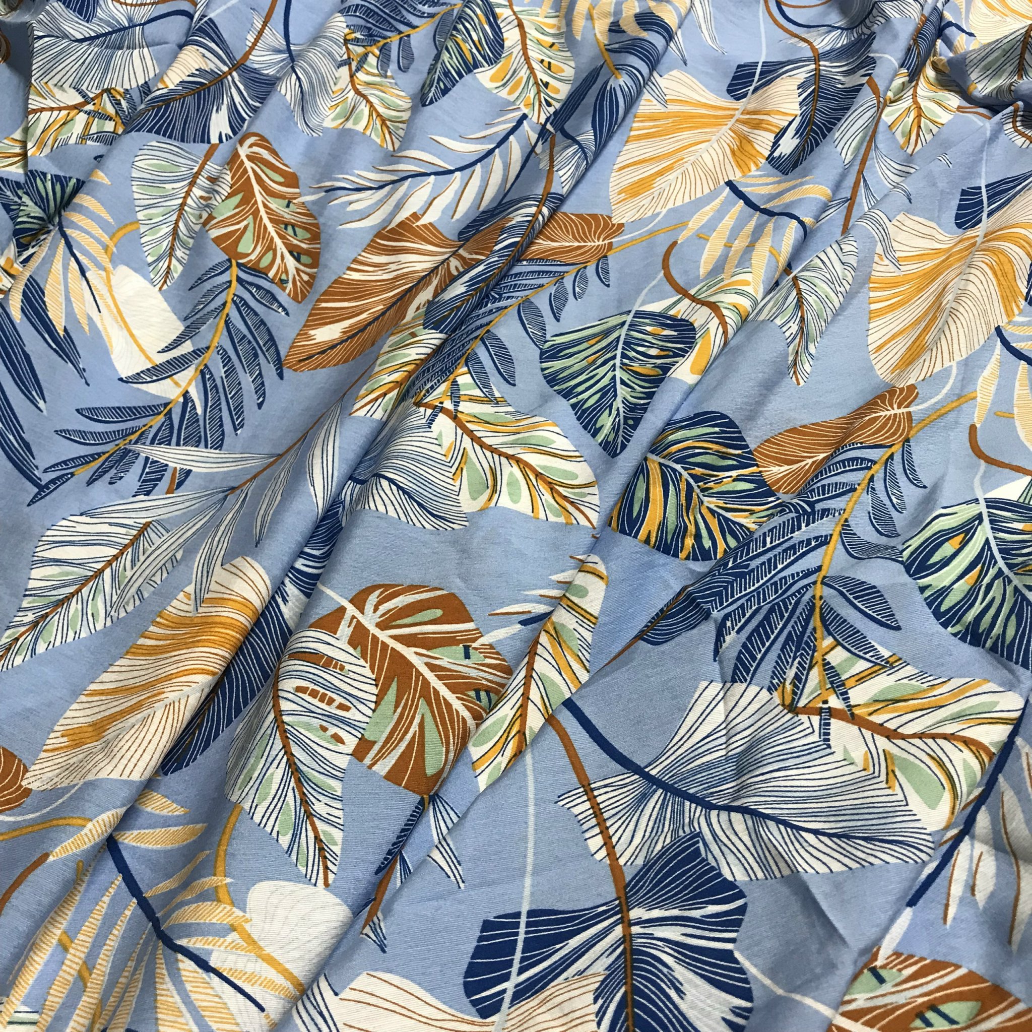 Vải đũi tơ Thái mềm mỏng họa tiết lá cây 2 màu nền xanh lơ